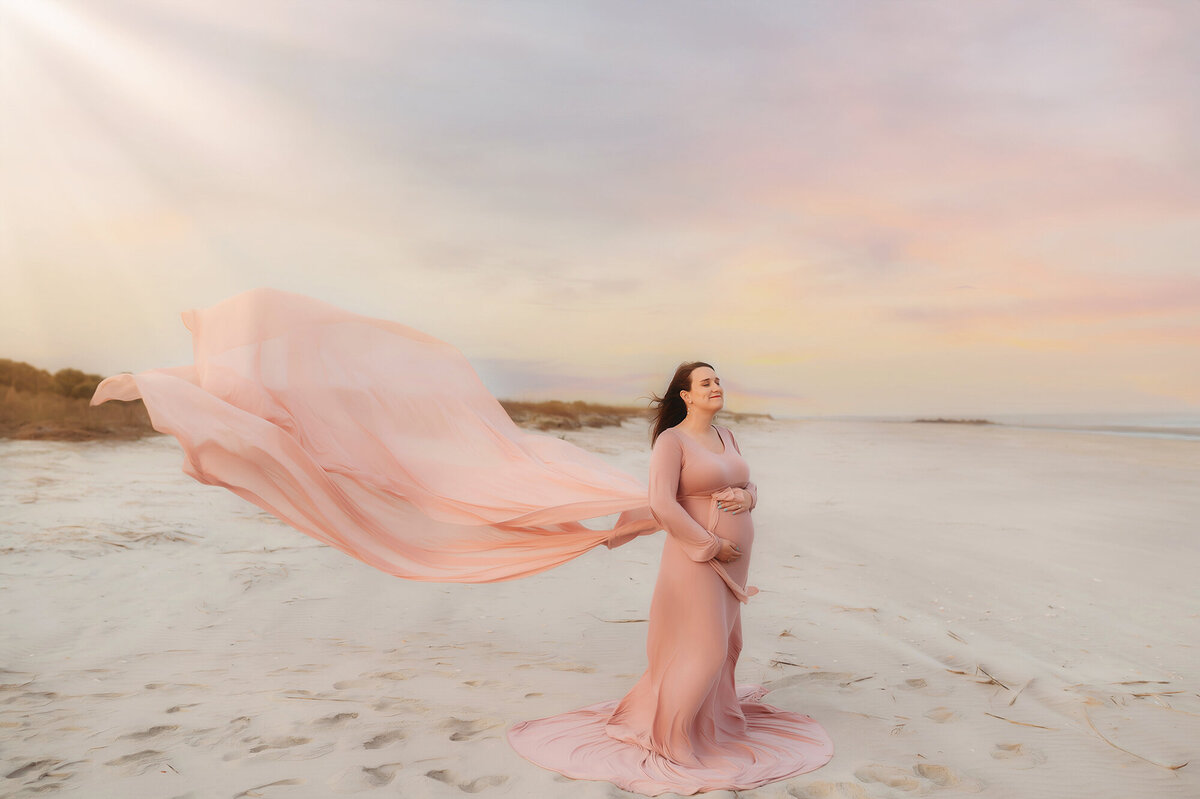 Expectant mother poses for Beach Maternity Photos in Charleston, SC.