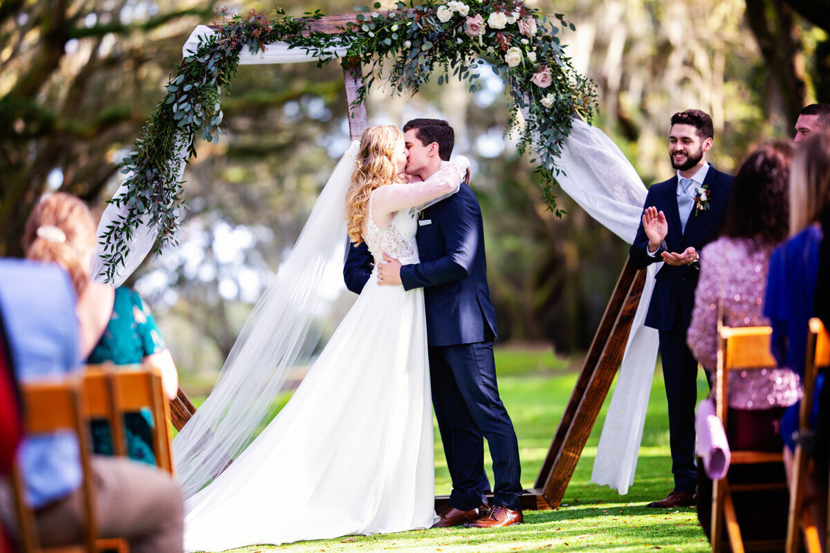 Legare Waring House ceremony first kiss Charleston Wedding Photographer