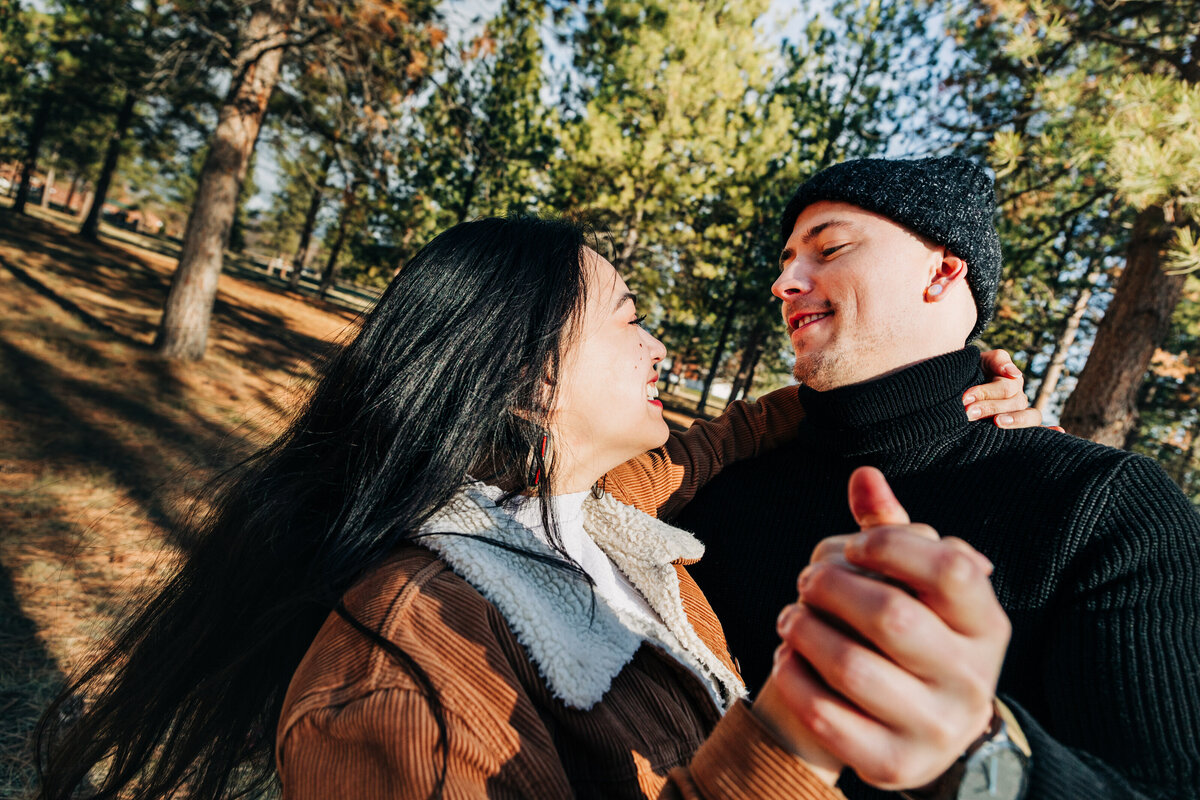 Missoula engaged couple dancing in forest