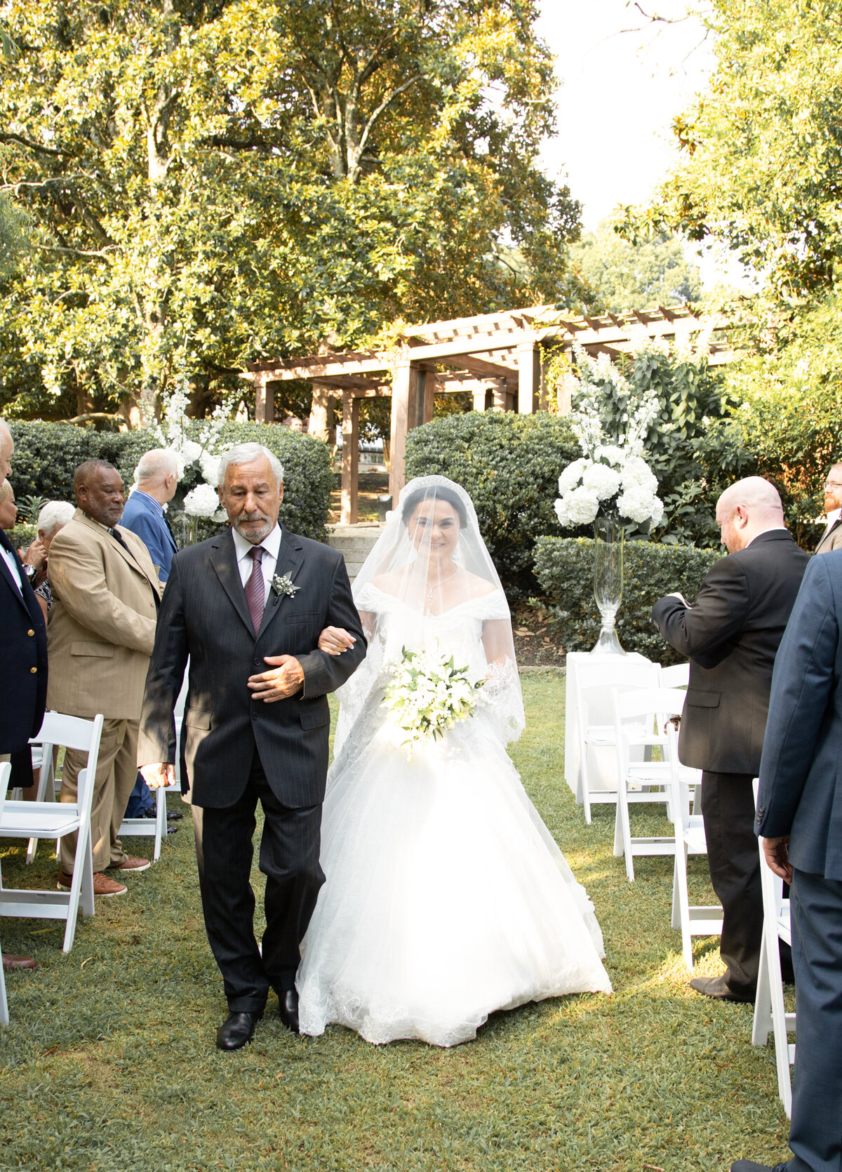 bride-walking-down-aisle-with-father-callanwolde-fine-arts-cente
