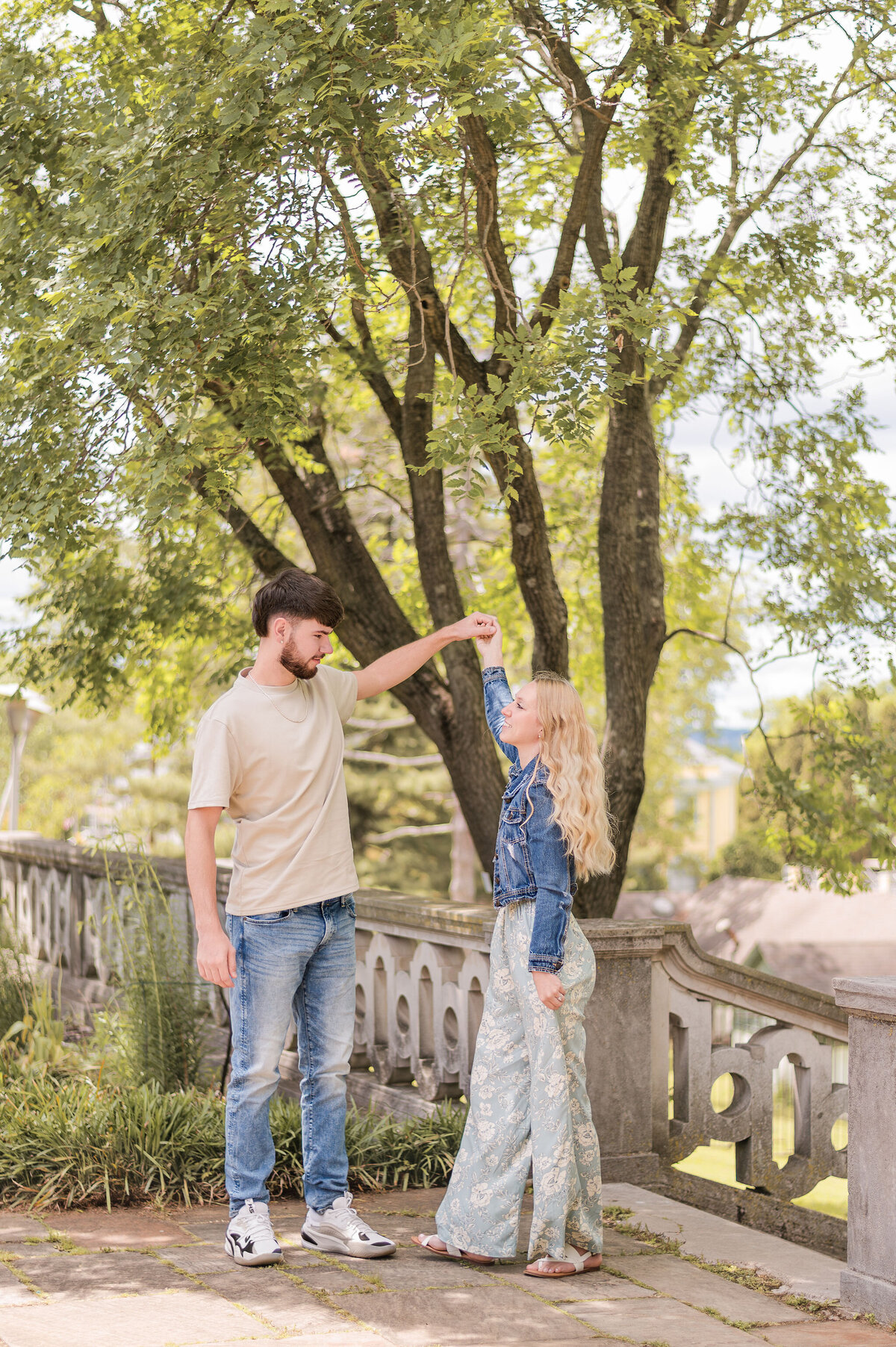 The Workmans dancing together during a joyful couples session in Pittsburgh — photographed by Bree Stewart of Lens Love Photography.