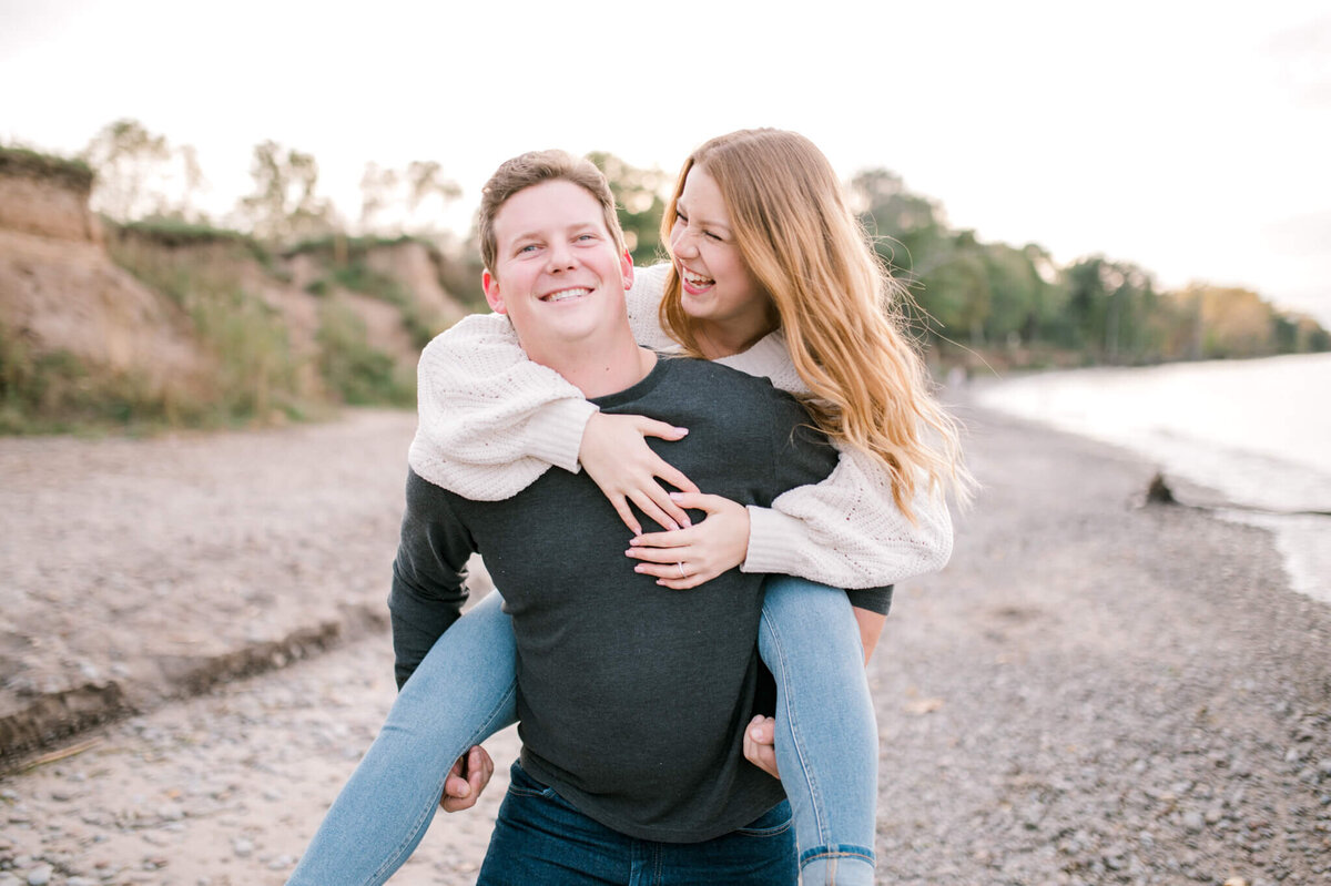 Woman on the back of a man for their Toronto engagement session