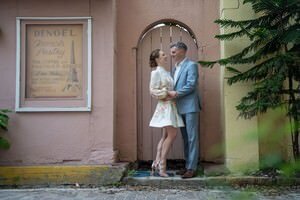 Elegant couple poses on historic brick street in St Augustine's district, captured by professional elopement photographers
