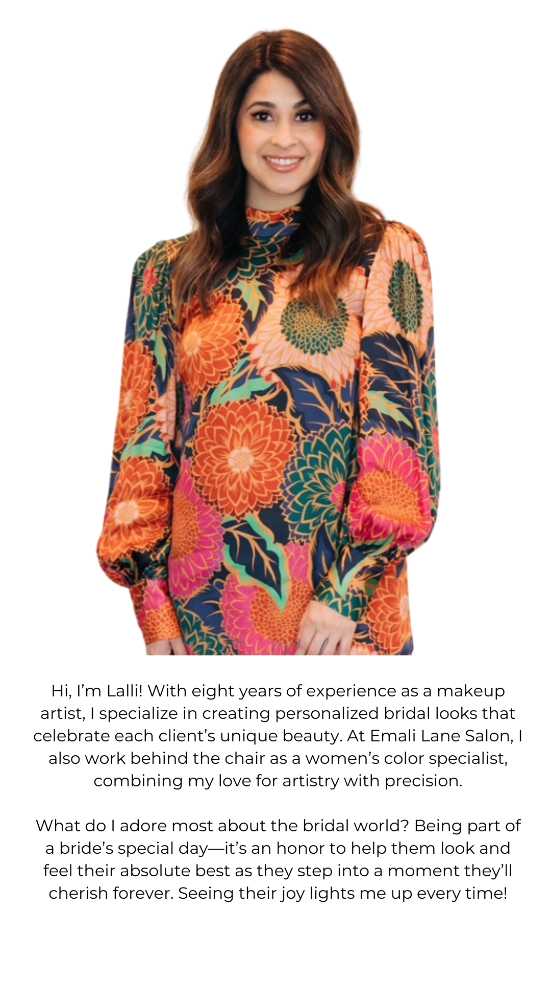 Woman in a colorful floral dress stands, smiling radiantly as if styled by a Hill Country wedding beauty expert.