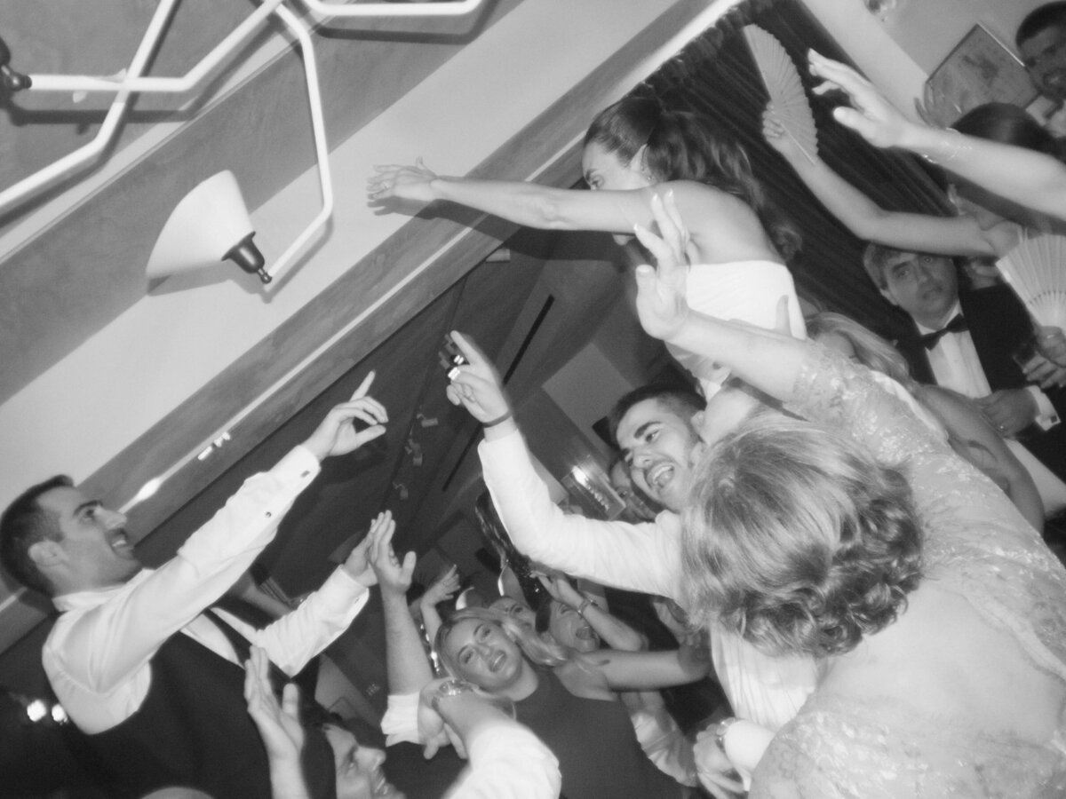 Bride and groom laughing during dinner speeches at Soho House Rome

