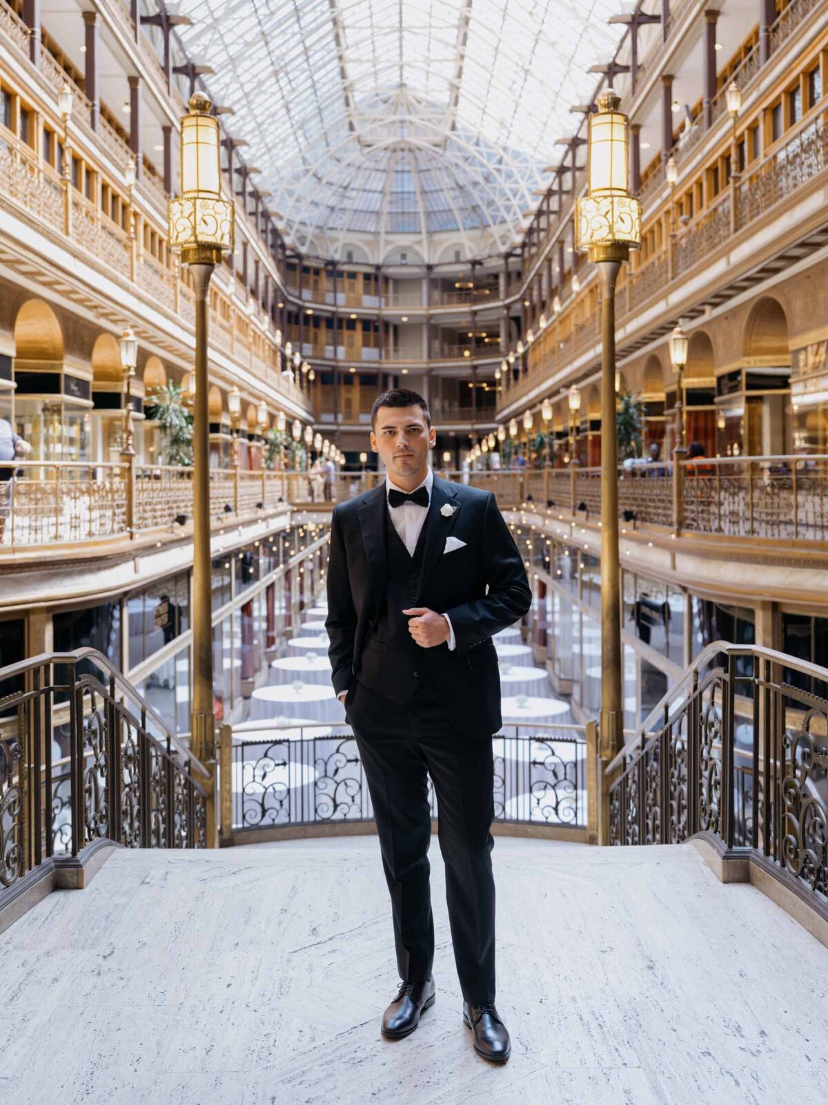 Modern wedding portraits of the groom inside The Arcade in downtown Cleveland