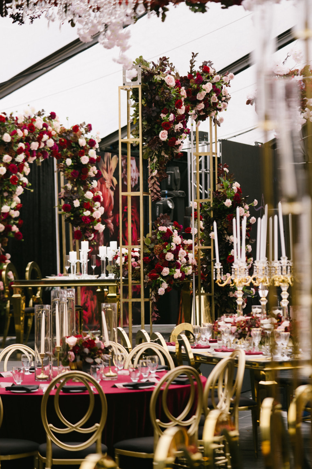 black-gold-burgundy-red-tent-reception-chandeliers-roses-candelabras-chairs