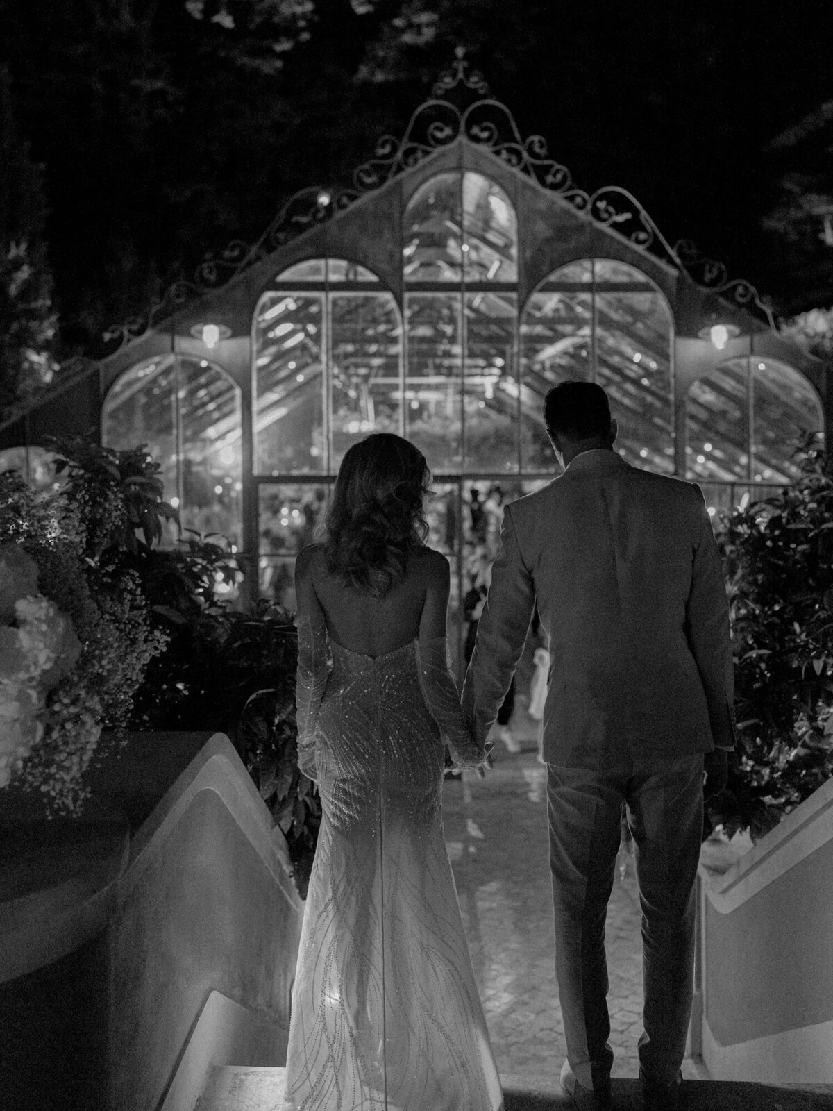 The engaged couple is entering their destination wedding reception in Quinta da Bellavista