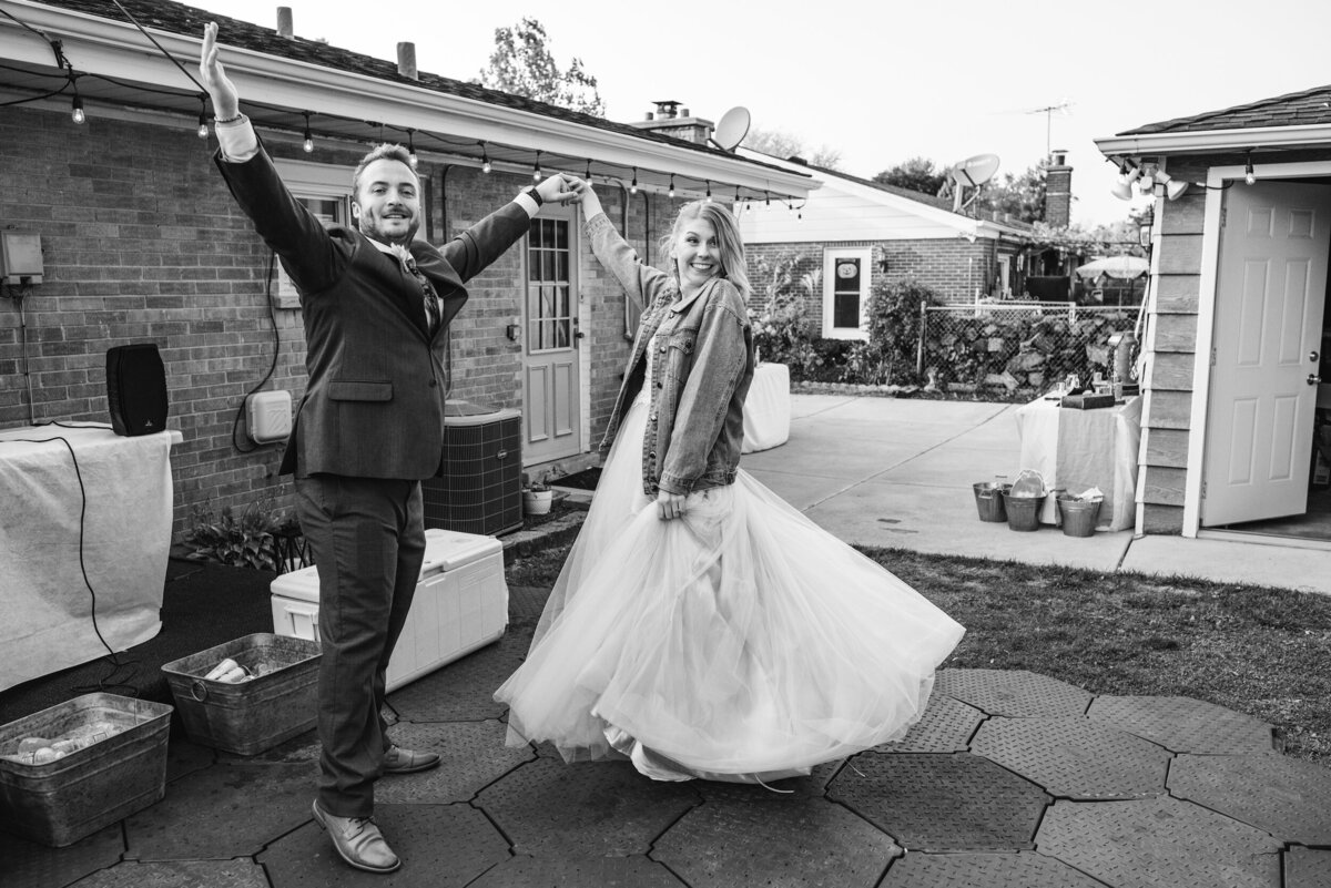 Bride and groom are candid during their backyard  emotional wedding