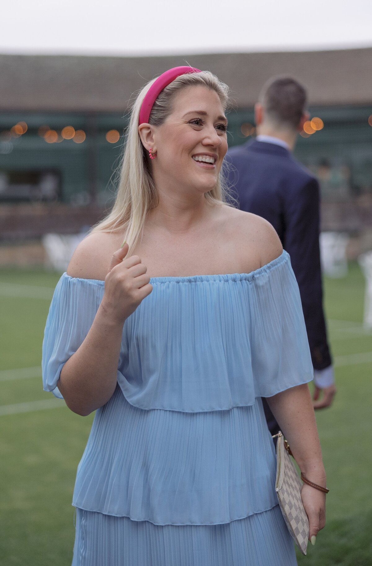 Guests mingle on the lawn of the Tennis Hall of Fame during a welcome party. 