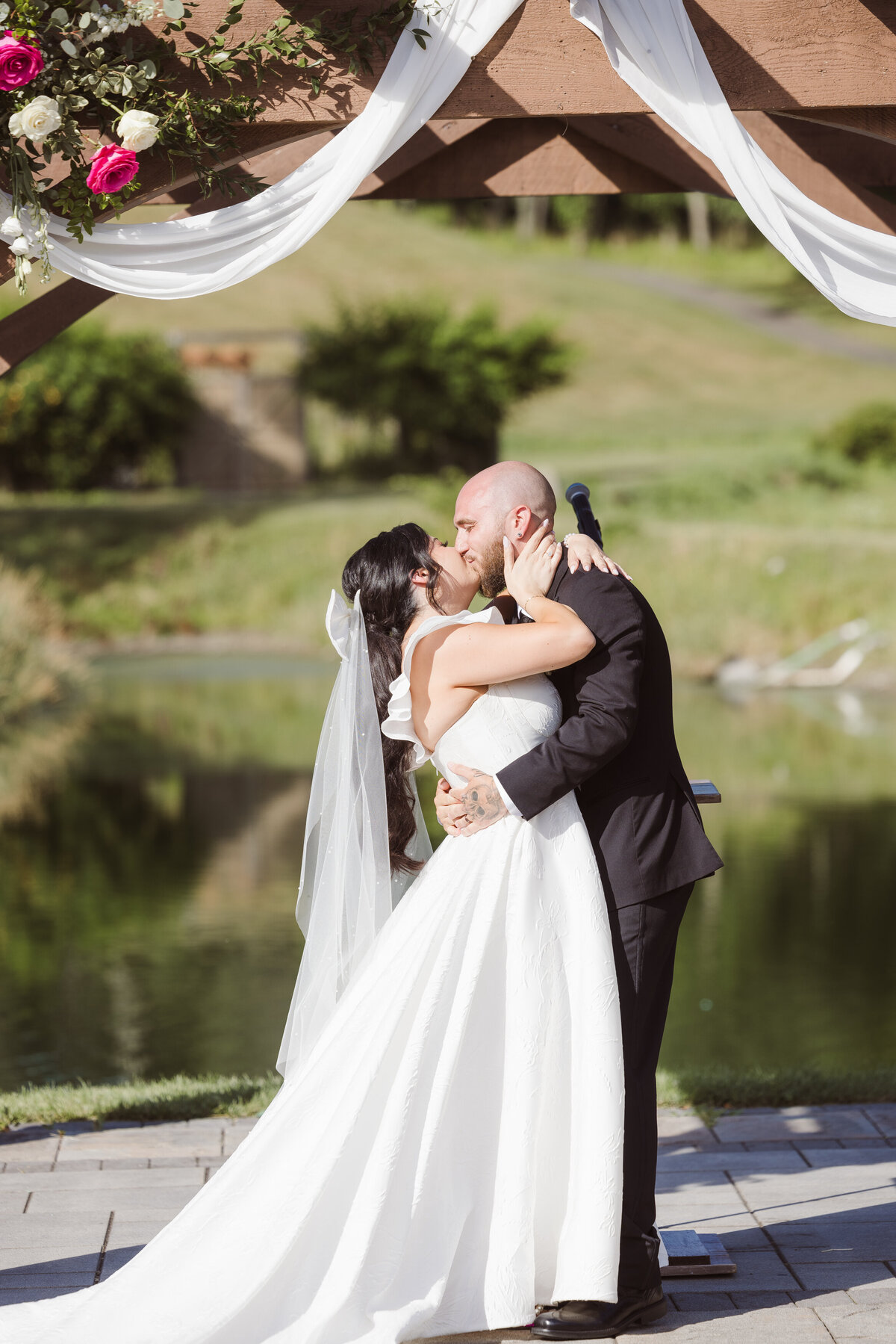 first kiss just married couple at bear brook valley hot pink theme elegant wedding