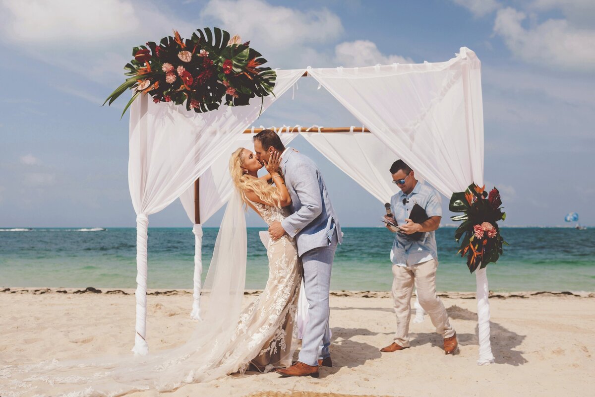 Bride and Groom's first kiss. at wedding in Cancun