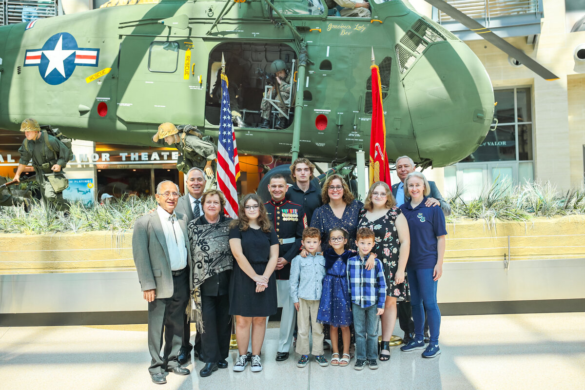 a military family celebrating promotion at the united states marine museum
