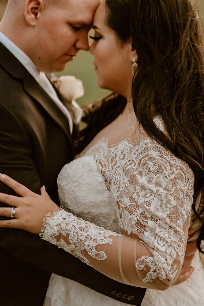 intimate-couple-embrace-lace-details-ashton-hill-farm-cedar-rapids-iowa-storyteller-collective-photo-co