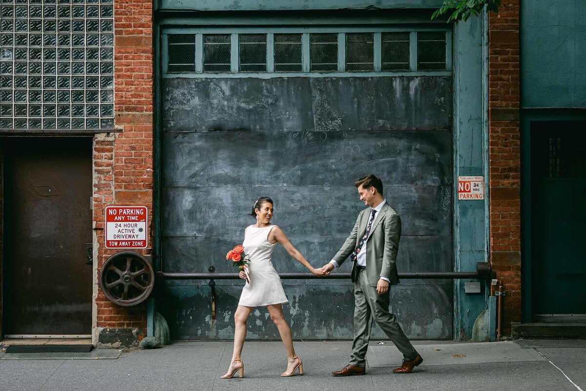 A couple walks on the street in Williamsburg, Brooklyn  after getting married.