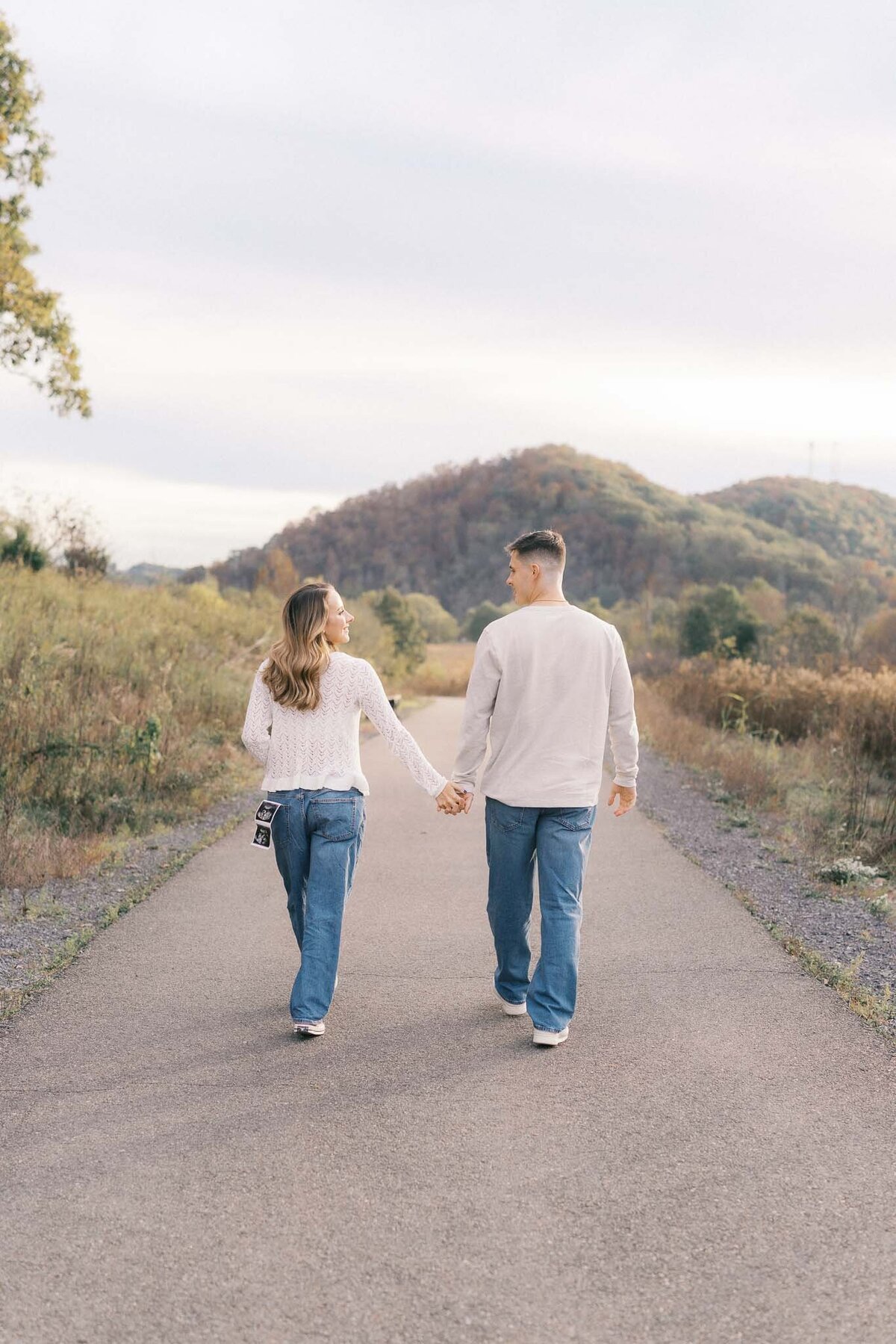 man and woman walk down path at seven islands park in kodak tennessee
