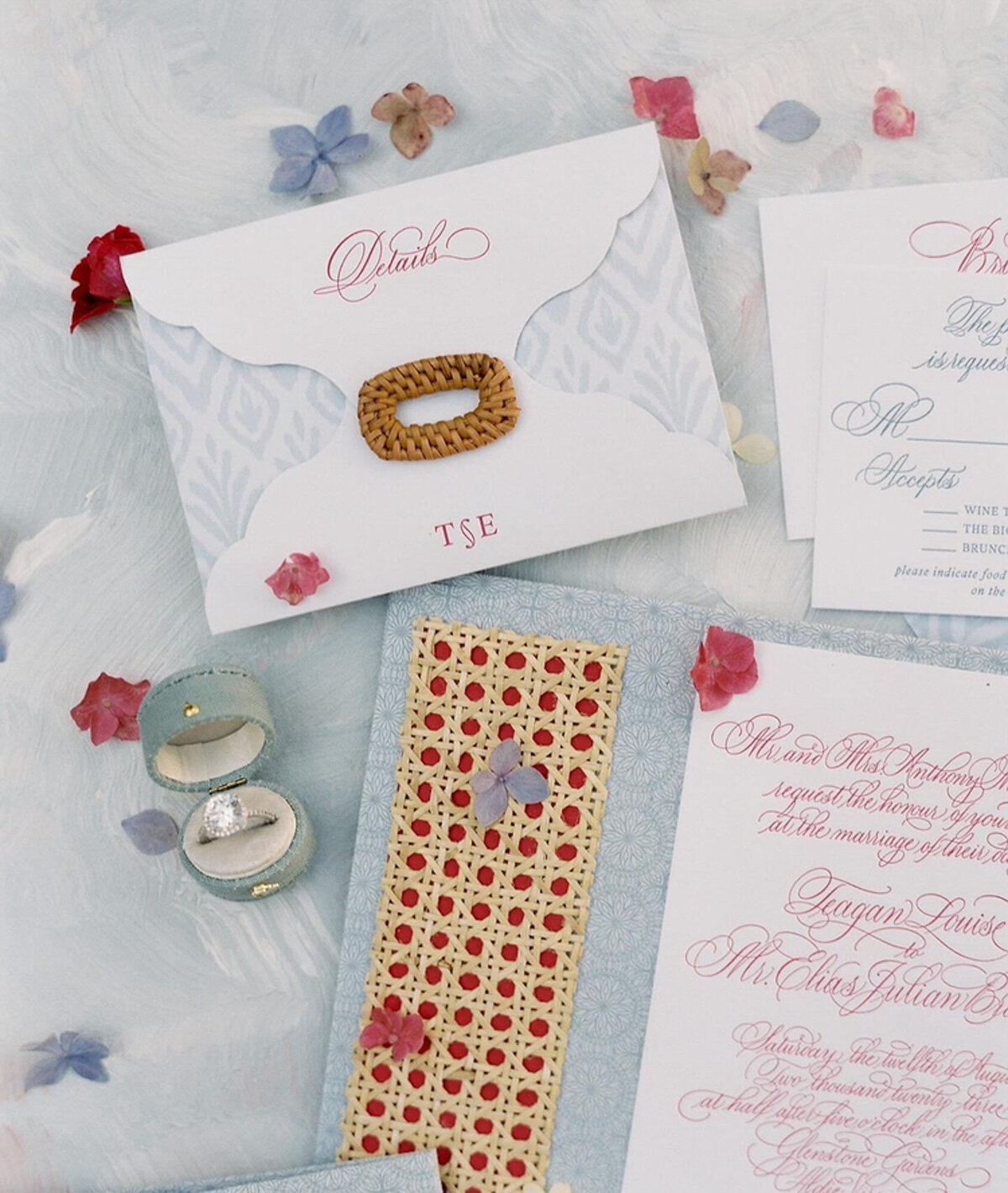 elegant wedding envelope and invitation with custom calligraphy and floral details