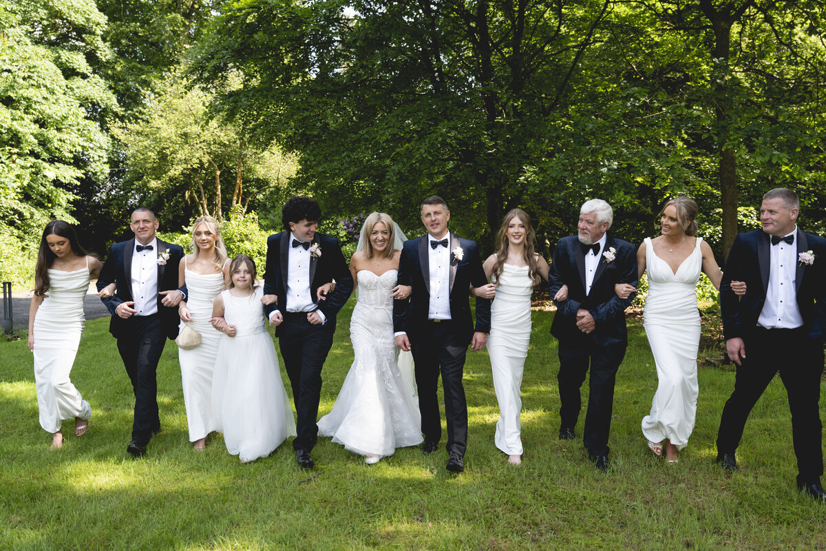 All the bridal party walking