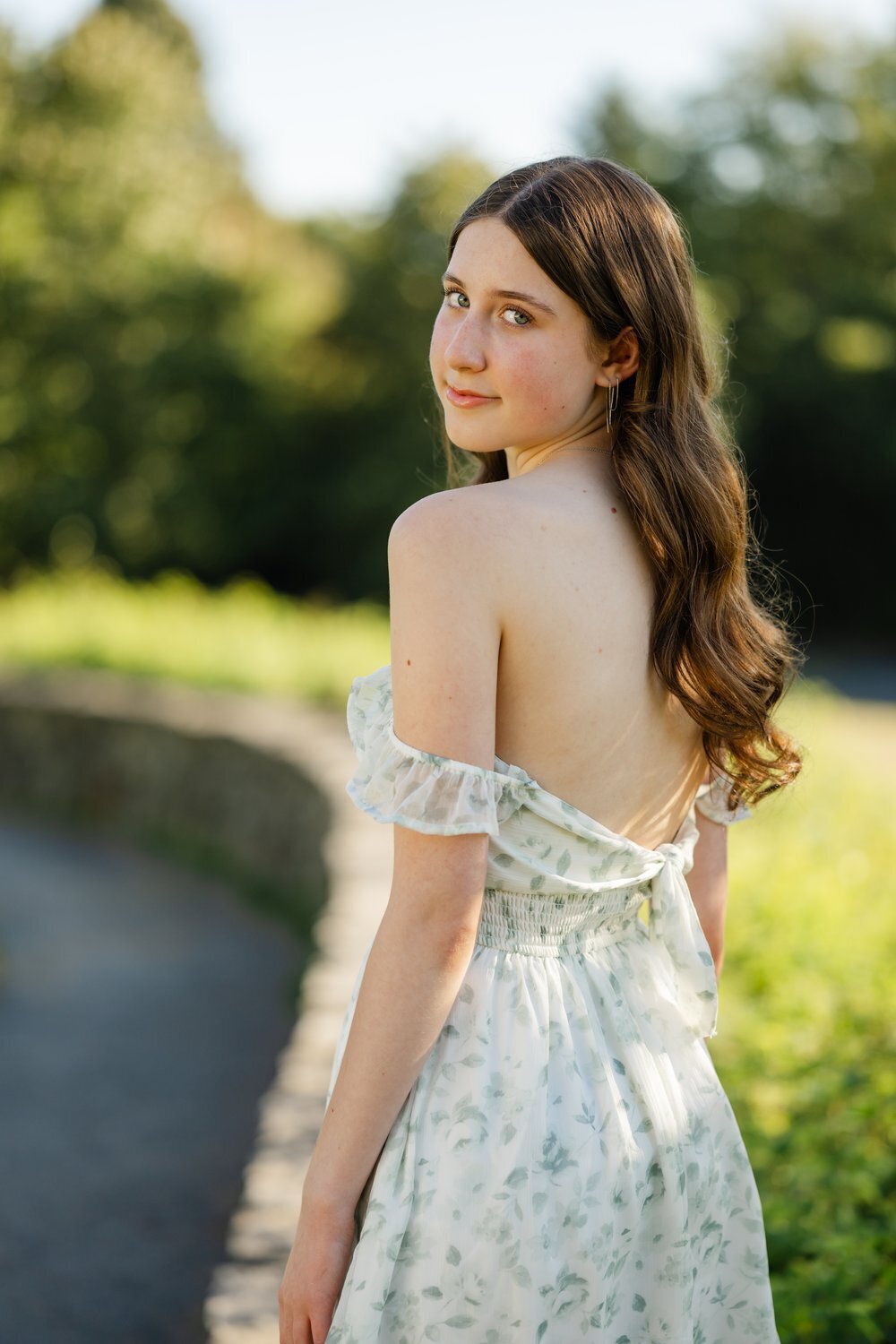 discovery park rock wall senior girl in dress