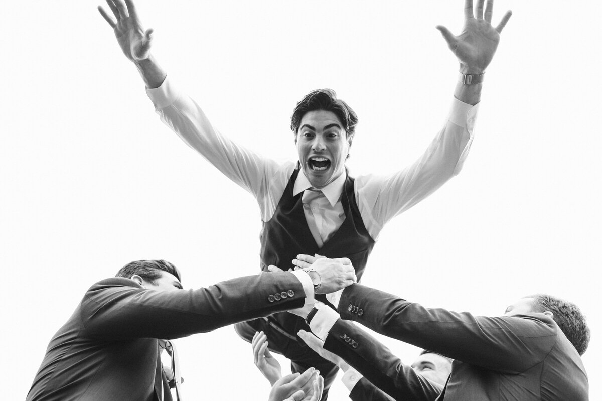 funny-groom-photo-thrown-in-air-like-superman