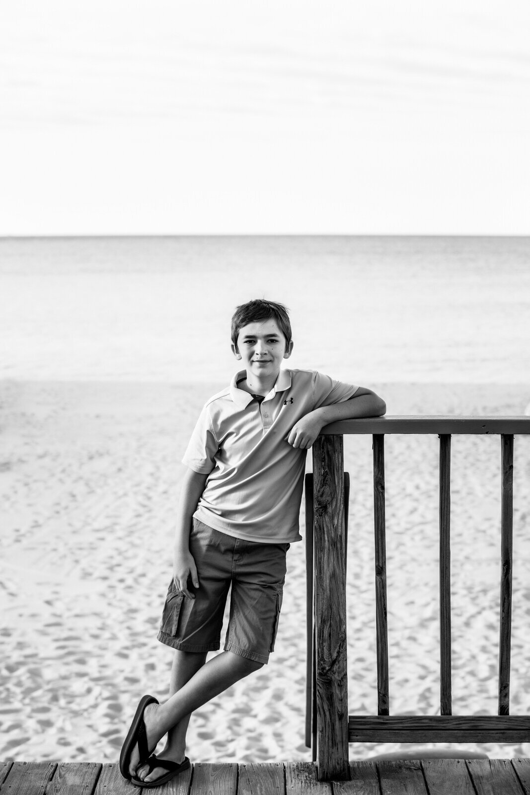 black-and-white-photograph-of-boy at-the-beach