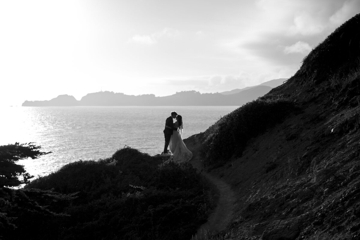 Bride and Groom at Marshall's Beach in San Francisco, California at sunset