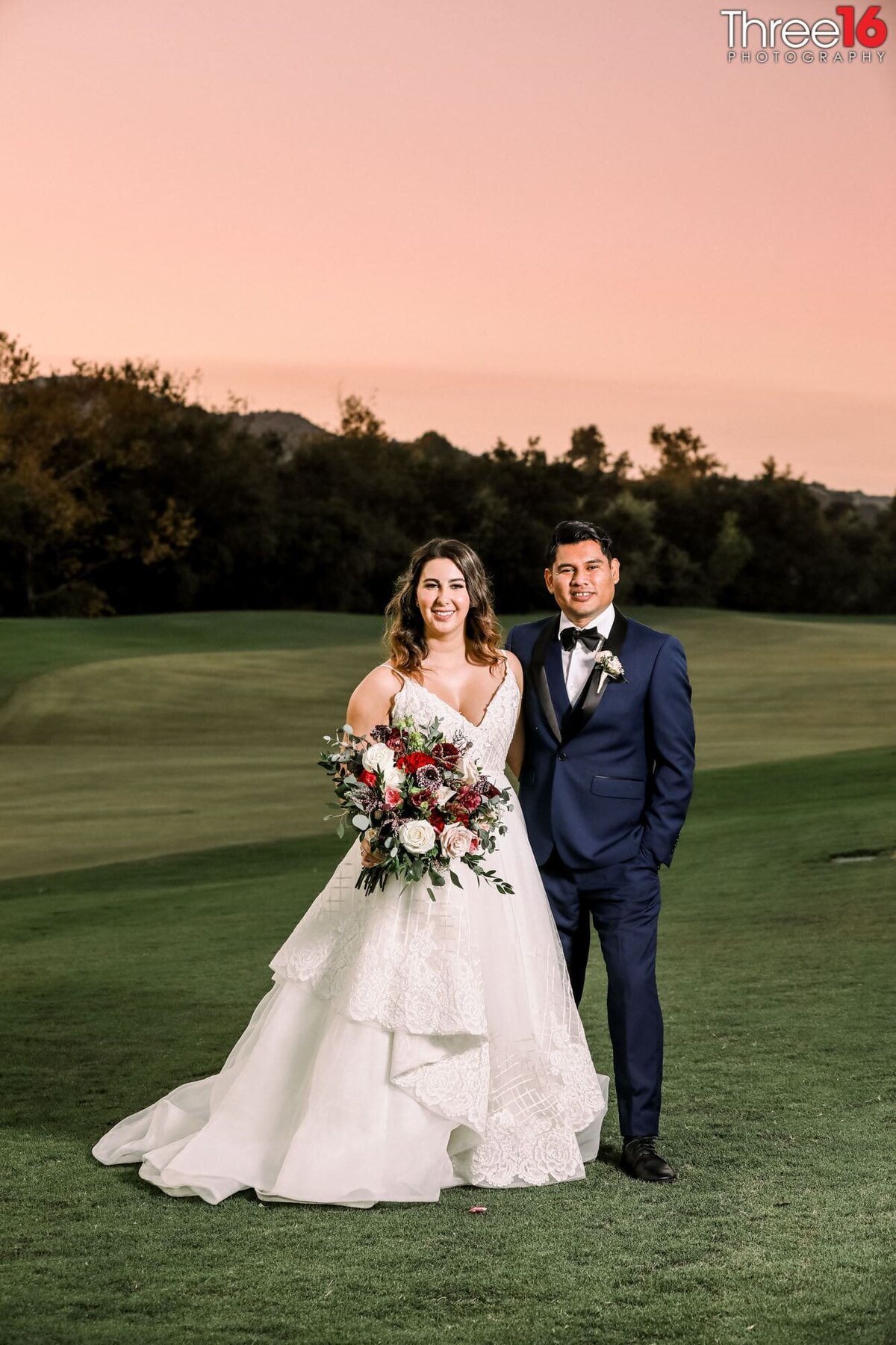 Newly married couple pose together on the golf course at the Coto de Caza Golf & Racquet Club