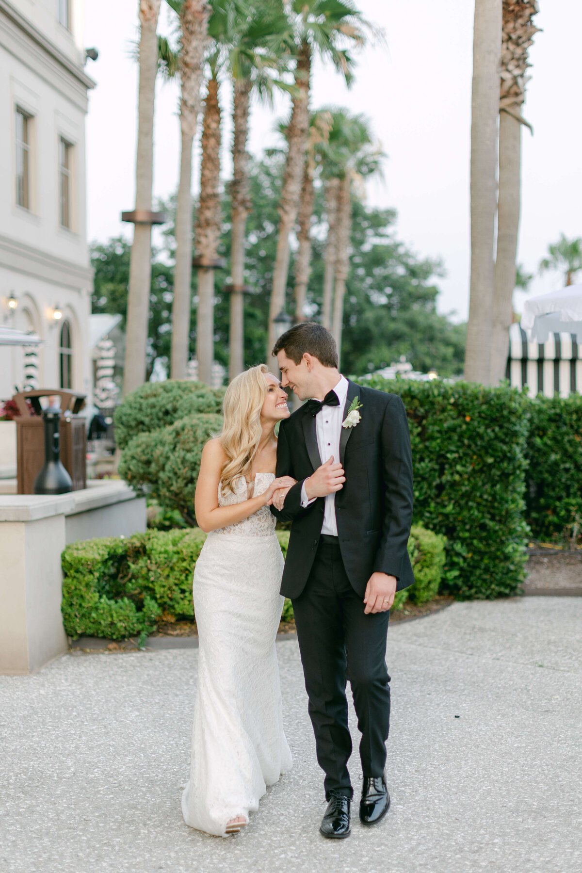 A bride and groom nuzzle in the courtyard of the Westin Savannah.
