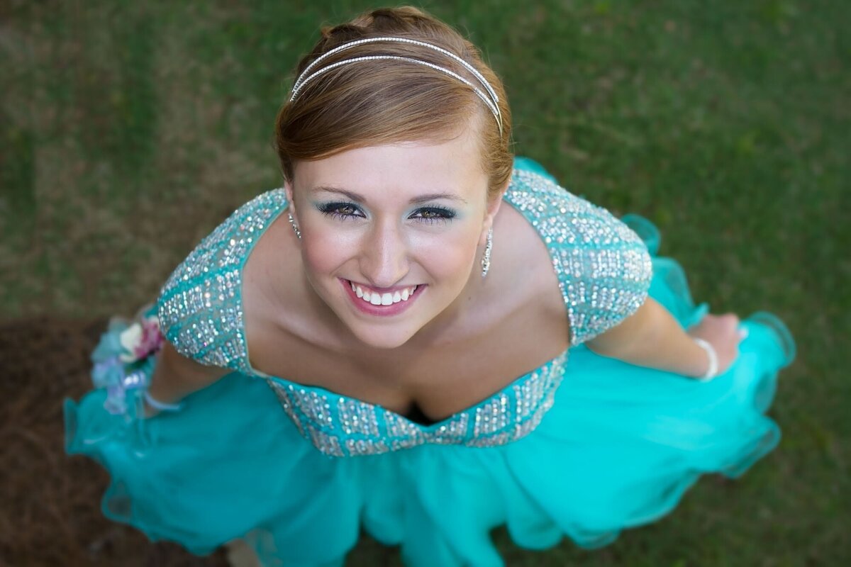 Senior prom portrait of a girl in a blue dress taken from above.