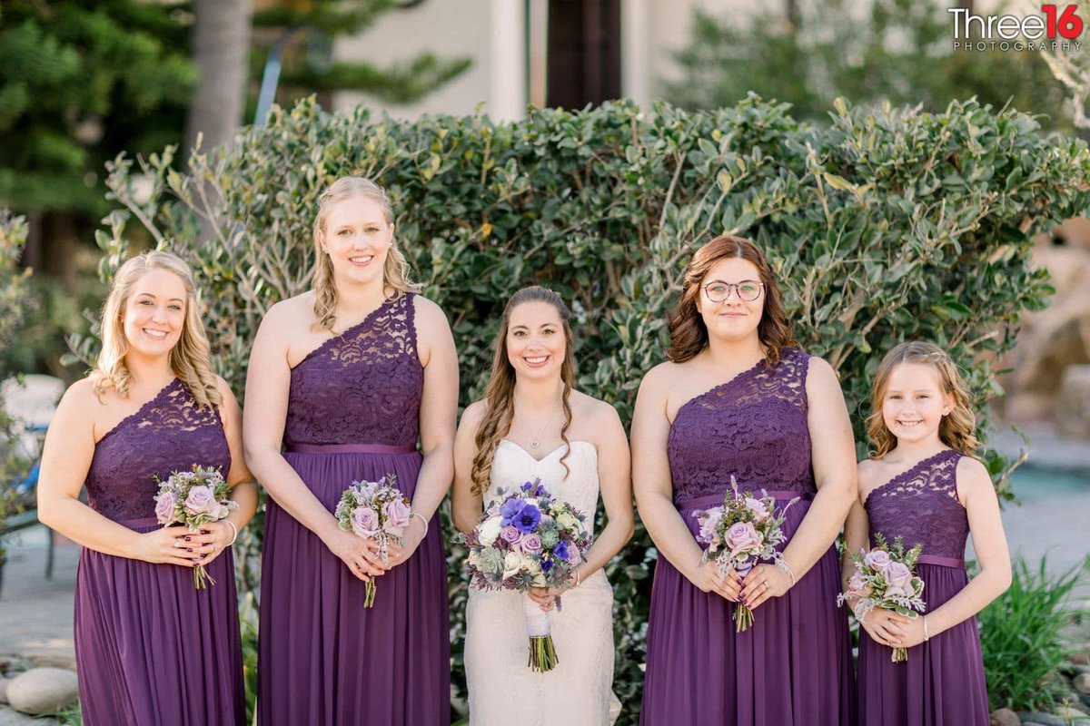 Bride and her Bridesmaids posing for the camera