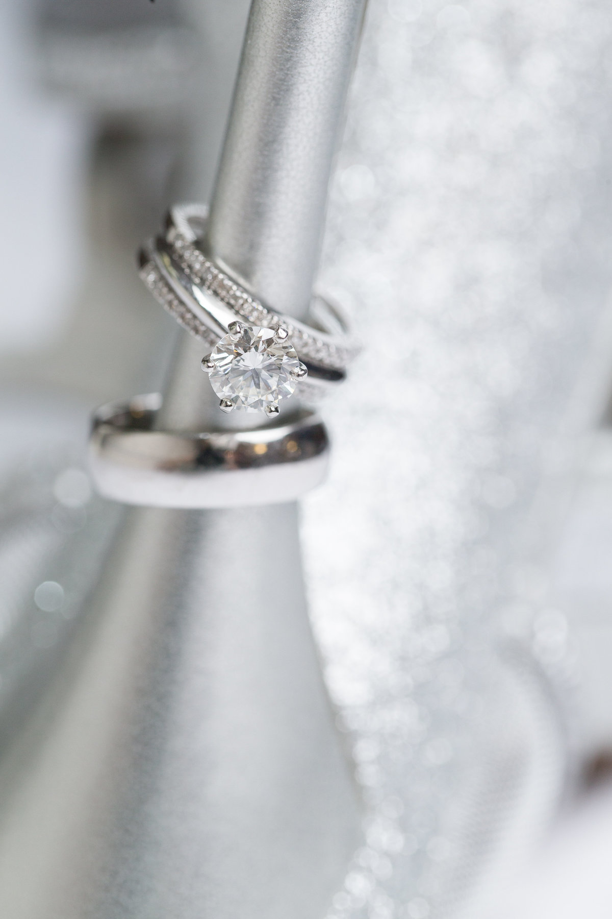 Detail shot of wedding ring and shoes.