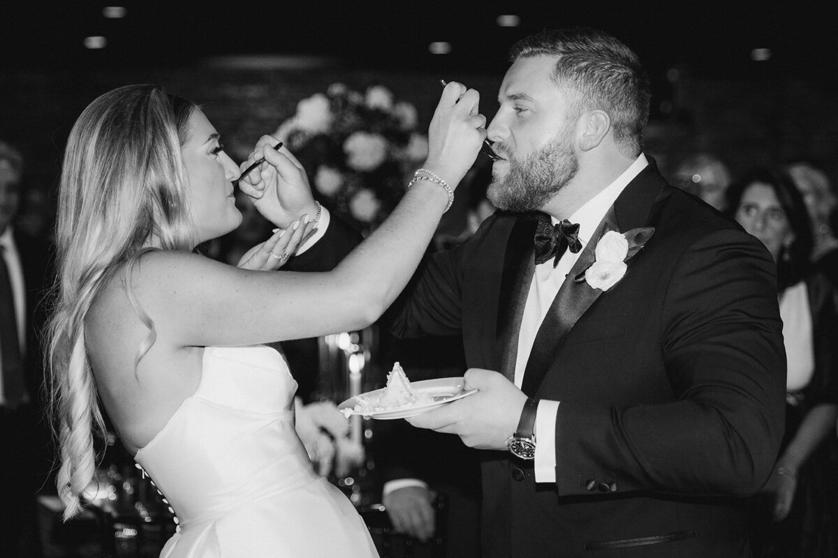 cake-moment-bride-and-groom-revel-motor-row-HBICWeddings