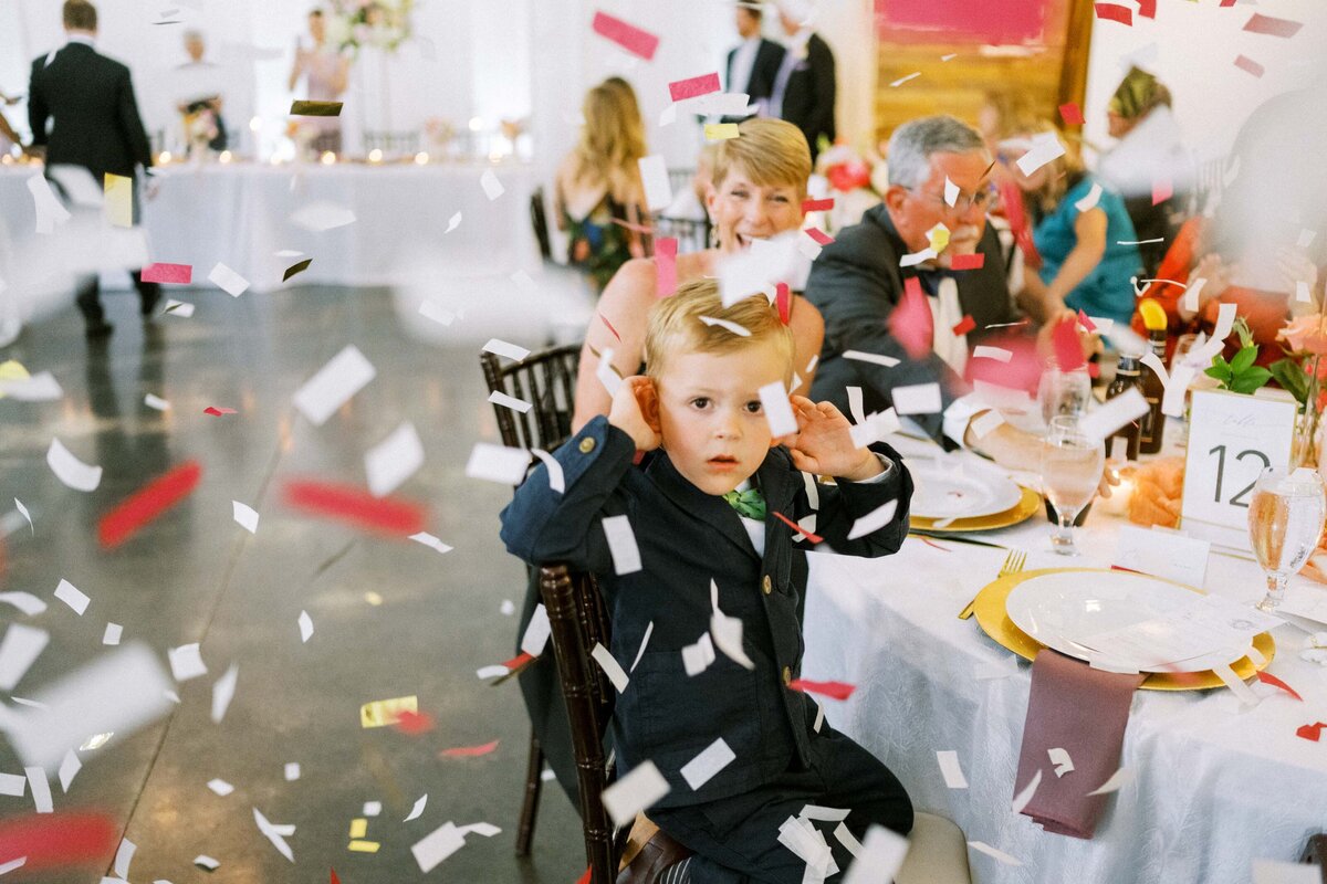 little-boy-covers-ears-at-confetti-canon