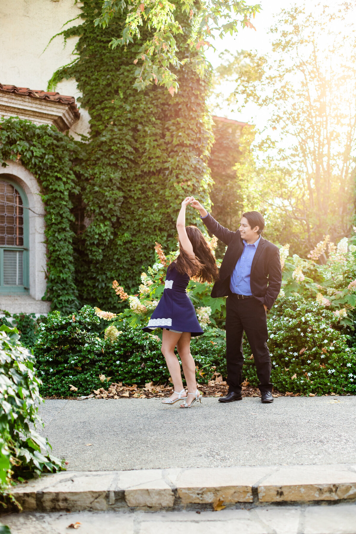 groom spins bride in magical light