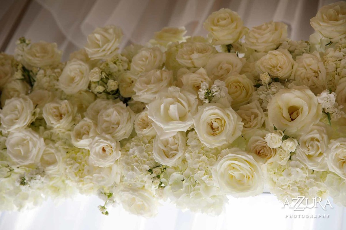 wedding arbor of all white roses