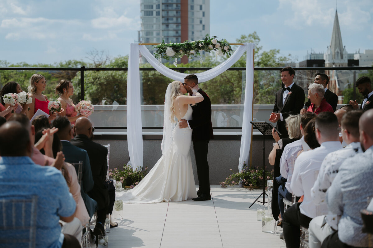 couple getting married on edmonton rooftop