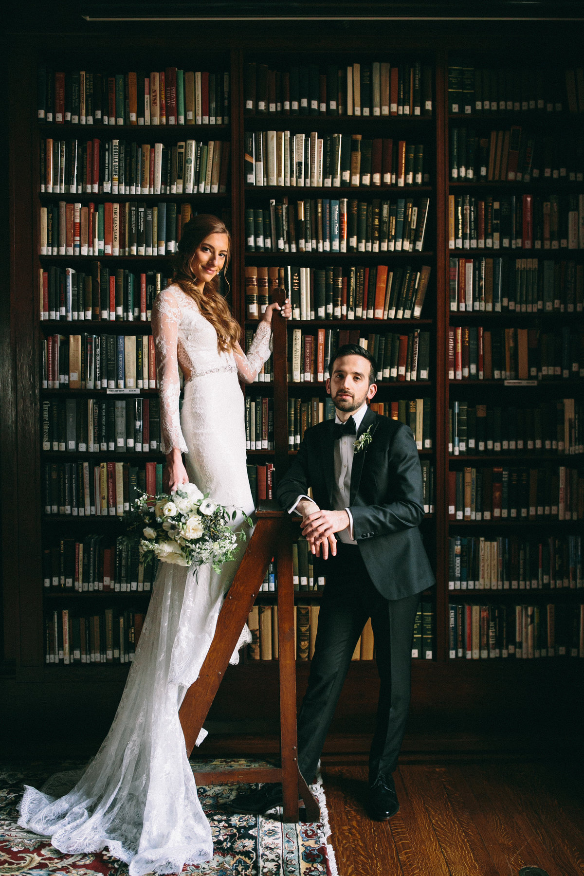 Dramatic portrait of this bride and groom photographed in the library at Philadelphia's Union League.