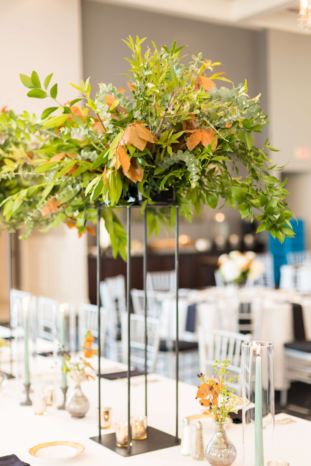 Tall florals arrangements on wedding reception tables at The Carrick House Wedding venue in Lexington, KY