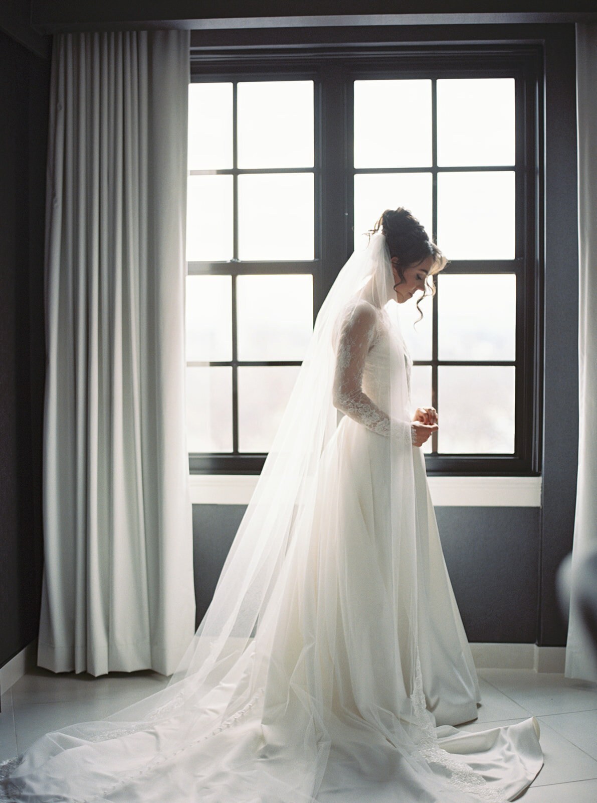 Bridal portrait by a big window at Hotel Washington.
