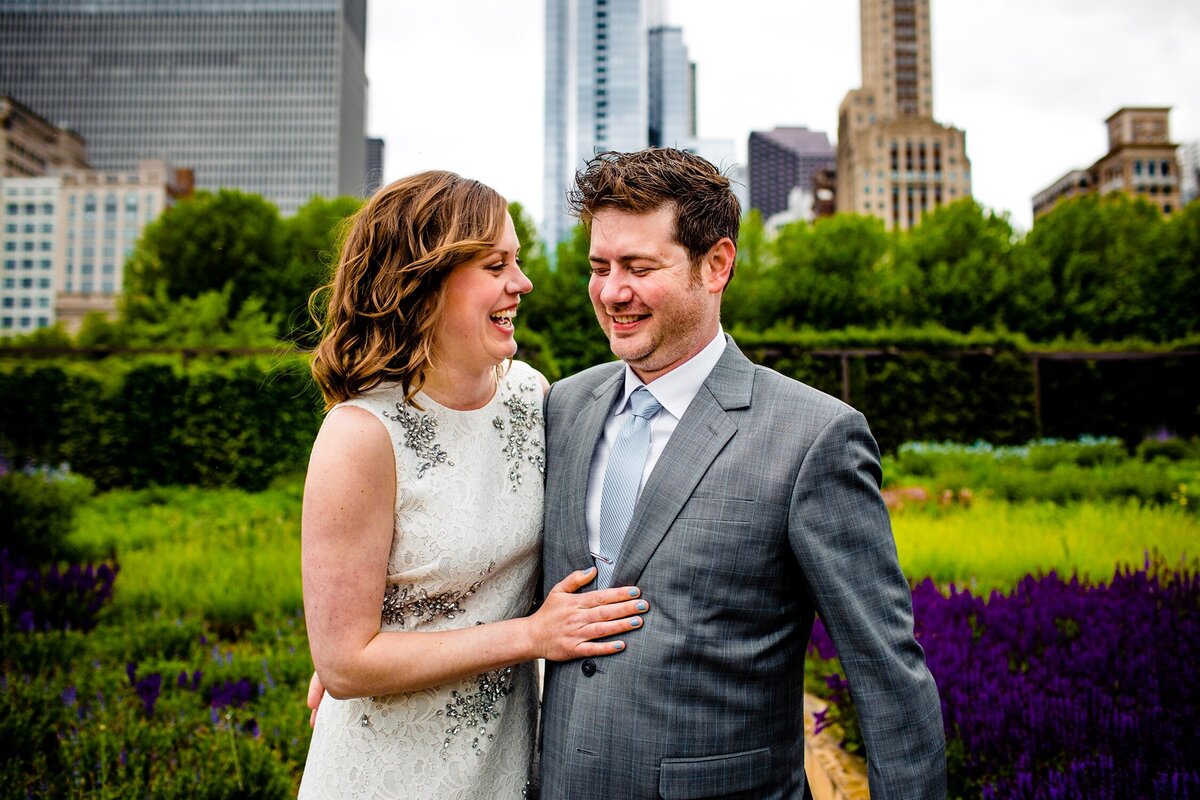 A couple laughs together before their Chicago Athletic Association wedding.
