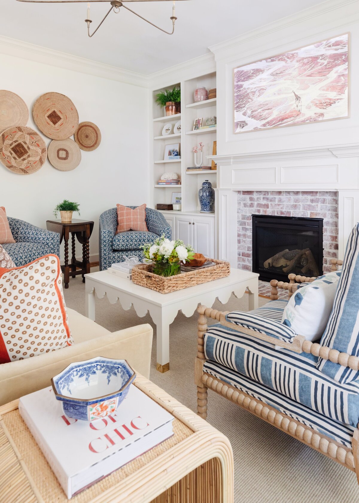 oyster creek studios oak forest remodel armchairs around a white coffee table with decorative walls