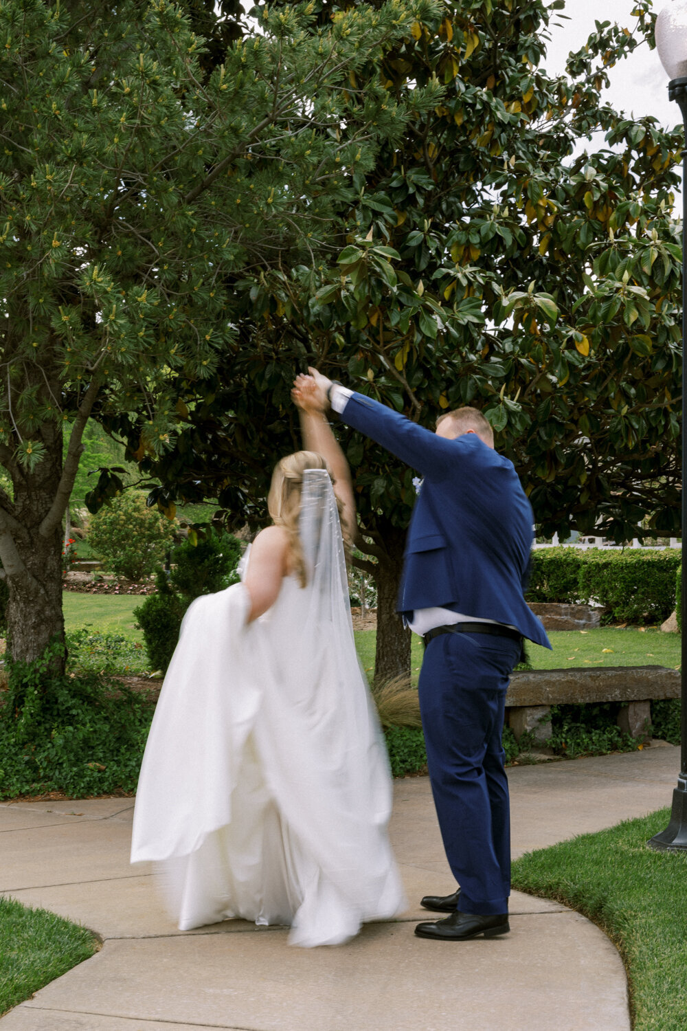 groom-twirling-bride-with-motion-blur