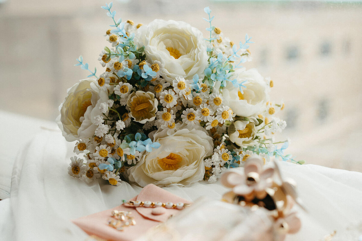 An elaborate blue and white floral bouquet 