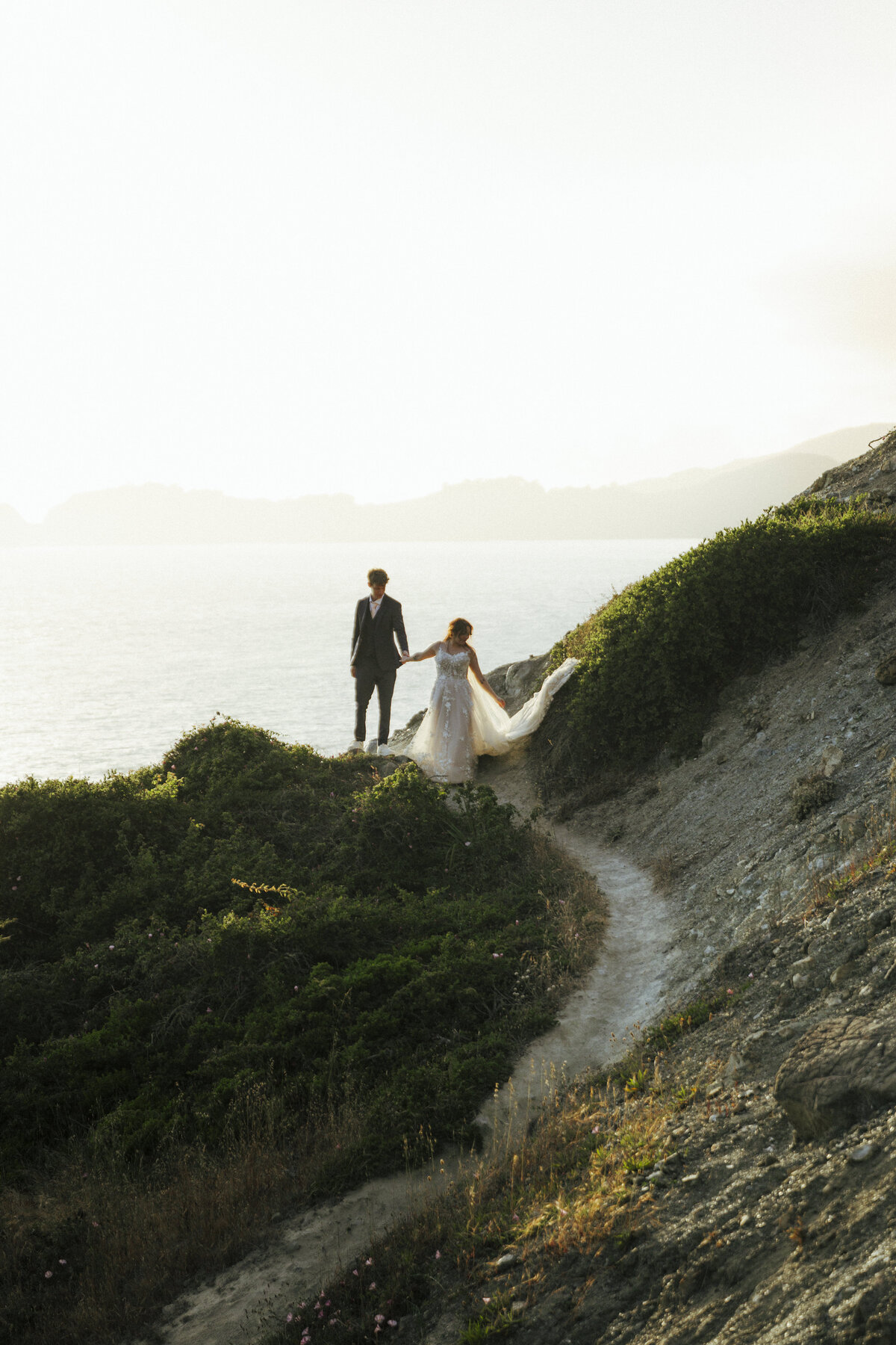 Bride and Groom at Marshall's Beach in San Francisco, California at sunset