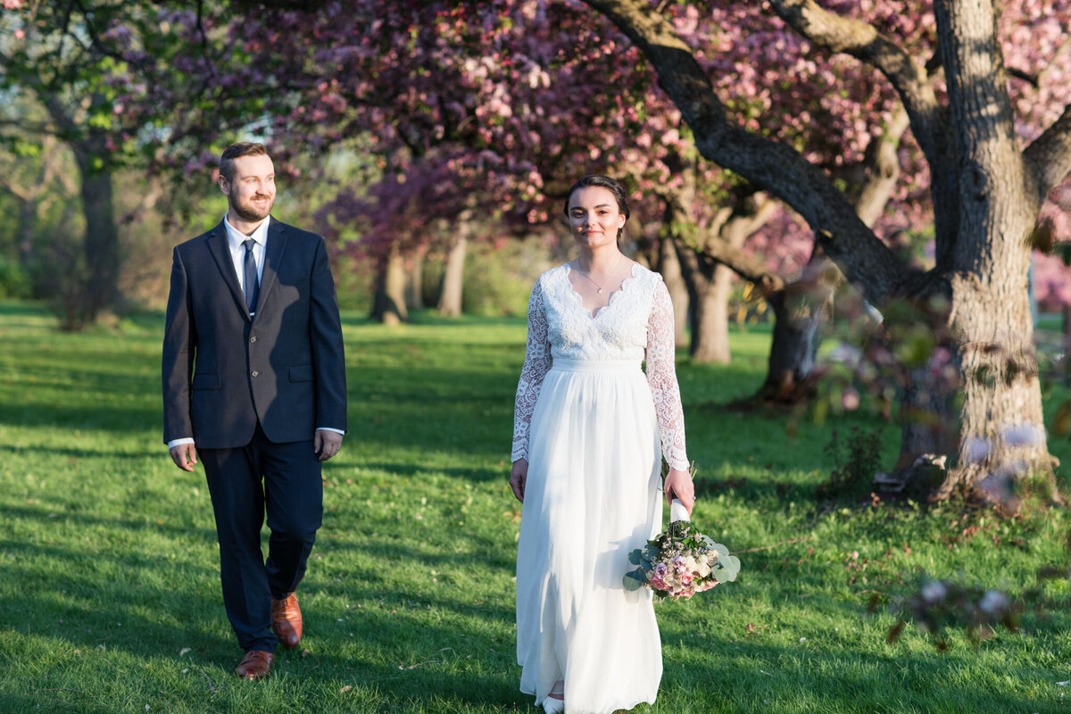 Embark on a romantic journey with Taylor and David as they share an intimate stroll through Ottawa's Dominion Arboretum, surrounded by the delicate beauty of cherry blossoms. Ottawa Wedding Photographer, Lauren Duffy, skillfully captures the essence of their love - David's warm gaze directed at Taylor, and Taylor's radiant smile, inviting the viewer into their joyous moment. Lauren Duffy Photography showcases the natural elegance of Ottawa's landscapes, immortalizing the tender connection between Taylor and David. Discover the artistry that defines Ottawa weddings with Lauren Duffy Photography, your trusted source for capturing love stories in the heart of the capital.