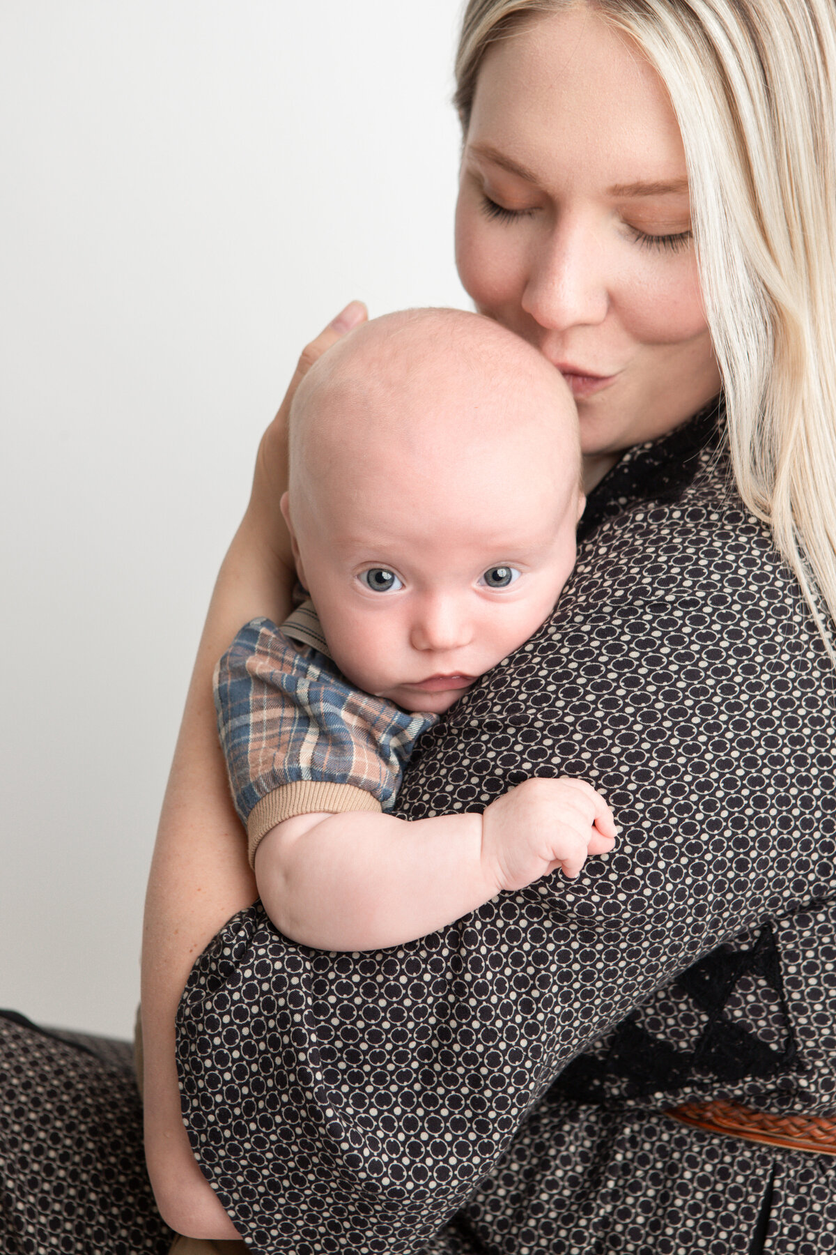 Edmonton mom and baby pose with white studio backdrop
