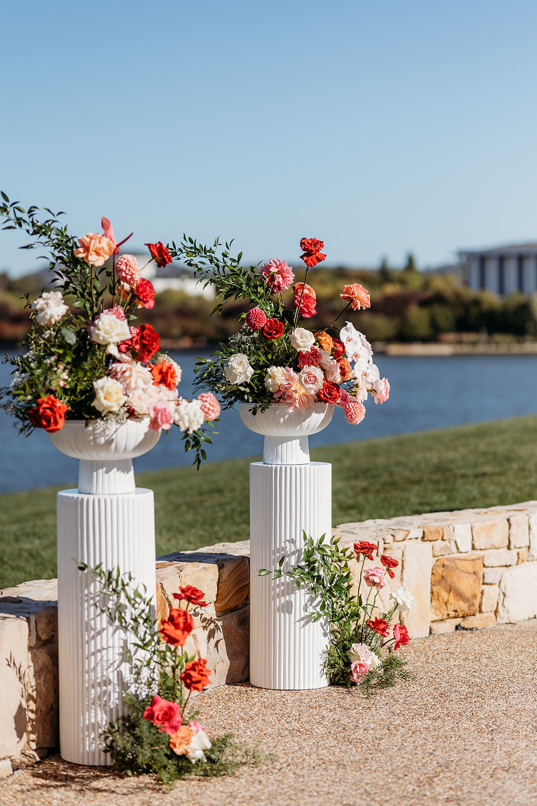 Wedding ceremony florals on plinths at The Marion overlooking Lake Burley Griffin