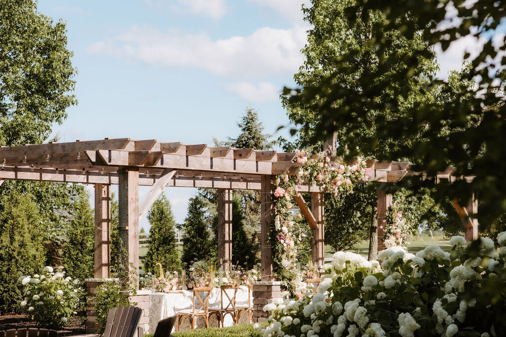 fairytale garden pergola wedding surrounded by white hydrangeas at the Willowbrook wedding venue