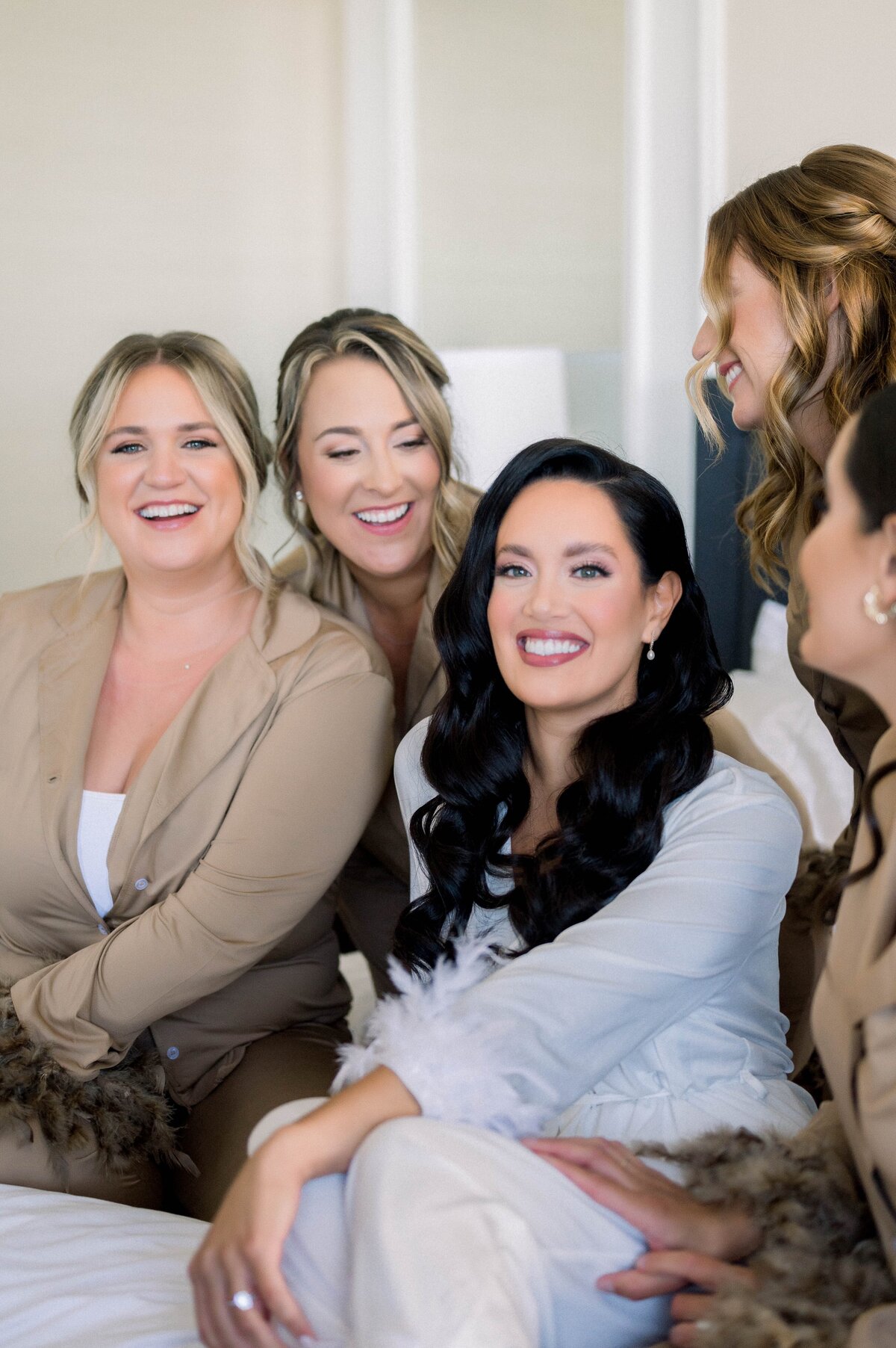 bride and bridesmaids getting ready before wedding