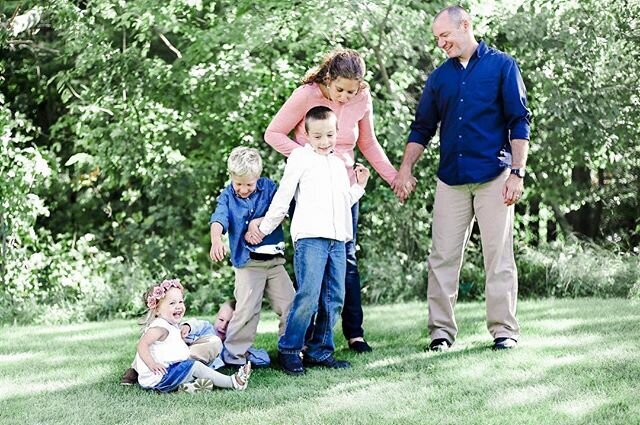 funny photo of family falling down and laughing
